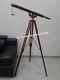 Nautical Vintage Marine Telescope With Brown Wooden Floor Tripod Stand
