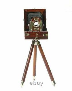 Vintage look antique film studio camera collectibles with wooden tripod stand