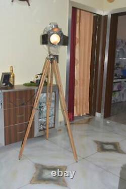 Vintage style chrome spotlight lamp on wooden tripod base floor lamp lighting